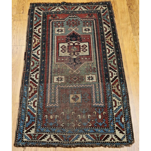 An extraordinary antique Fachralo Kazak area rug from the esteemed weaving village of Fachralo, located in the southern...