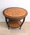 This elegant piece is a Louis XV oval side table, featuring a diamond/cube parquetry inlay. It is a "transitional" style...
