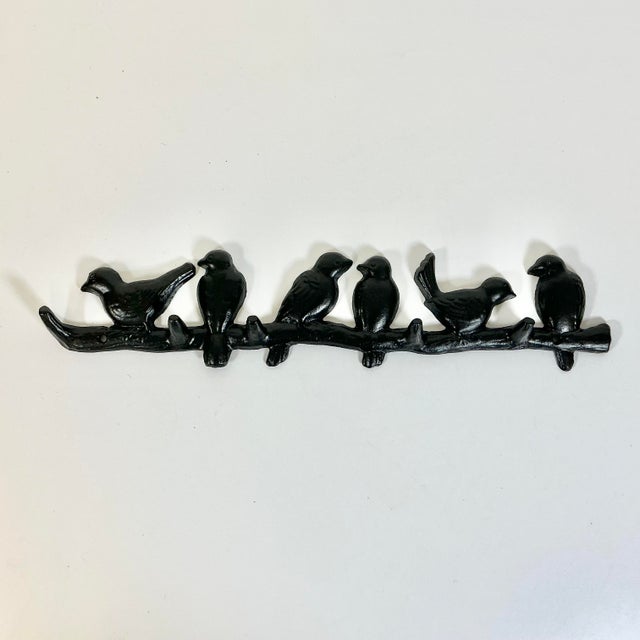 Offering a dramatic cast iron Wall Hook in the manner of Swiss artist Diego Giacometti. Giacometti grew up on a Swiss farm...