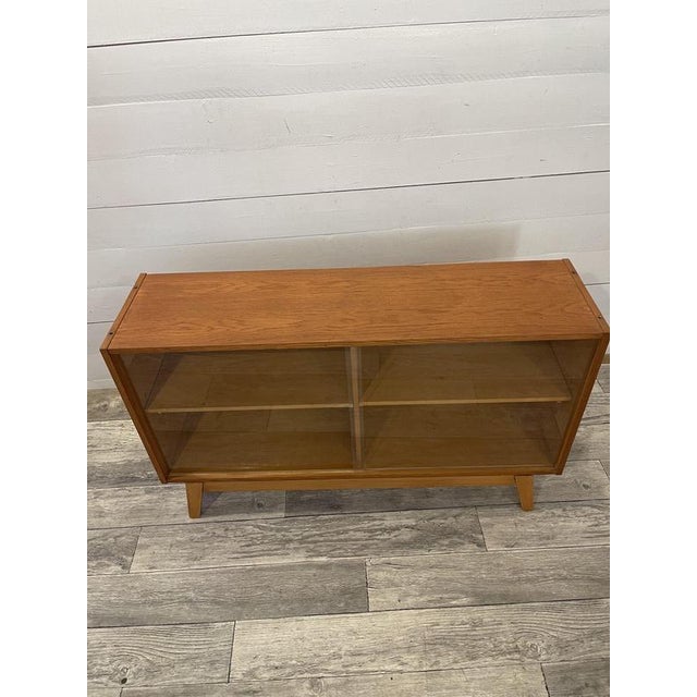 Vintage Small Commode by Jiroutek +-1968 Book case-showcase by Jiroutek with original sliding doors Rare Model Dims; H= 69...