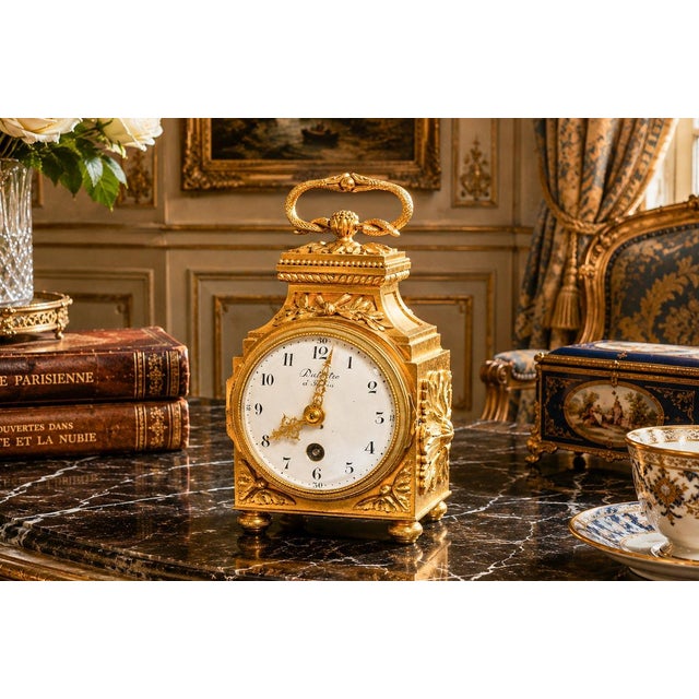 A superb example of late 19th-century French craftsmanship, this elegant Louis XVI Revival ormolu (gilt bronze) mantel...