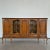 Made of solid walnut, this display cabinet combines strength and elegance. It has five drawers and five doors on three...