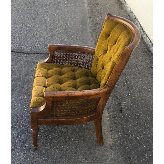 1960s era mid century vintage caned tufted back and seat velvet or velour armchair. Green material. Light wood covered by...