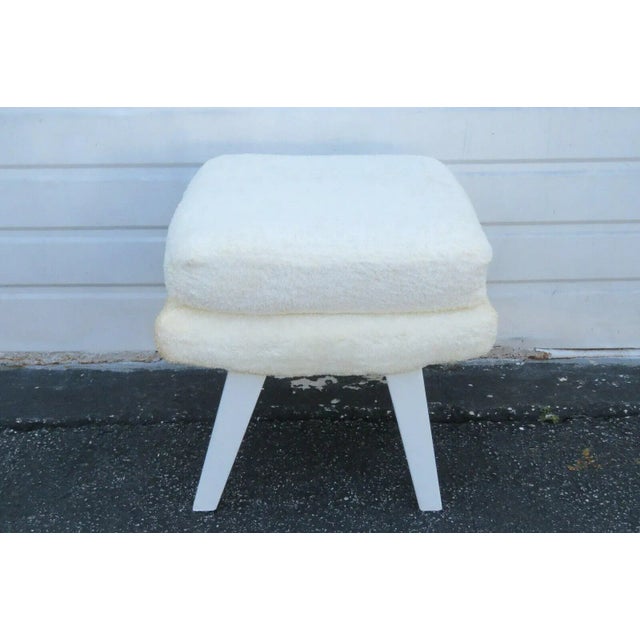 This charming Ottoman Footstool is made of wood, solid wood, and fabric, and is in good condition. This lovely Footstool...