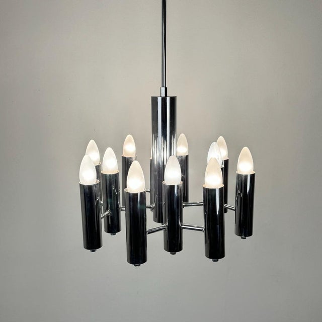 Mid-Century Modern Italian Twelve Bulbs Chrome Tubes Chandelier by Gaetano Sciolari, 1970s, in Very Good conditions....