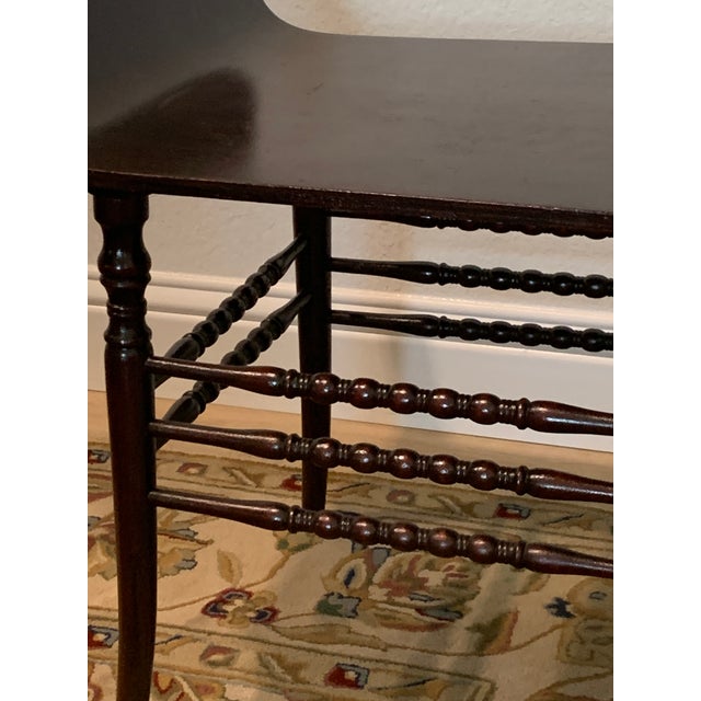 Offering an interestingly shaped vanity stool from the late 19th century in excellent condition. The seat is shaped with...
