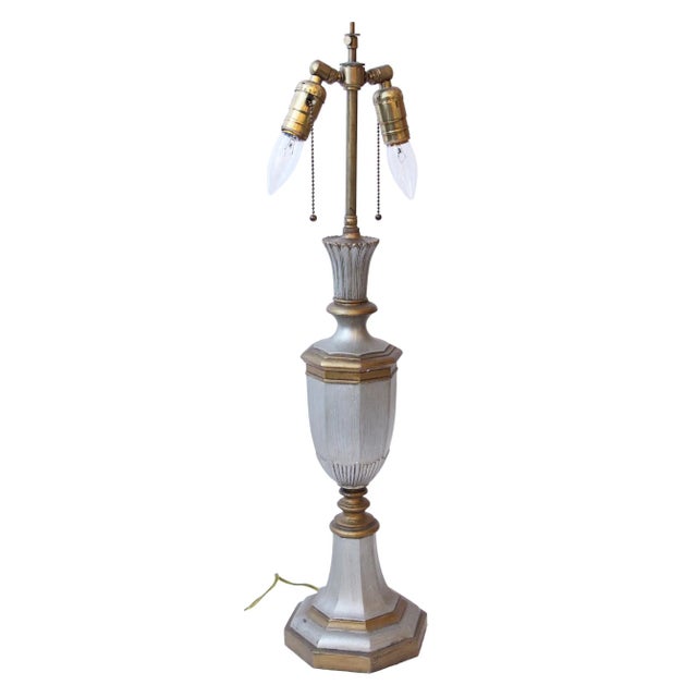 This 1900s Georgian style lamp has a silver and gold finish over bronze with two adjustable sockets. Made in England. One...