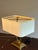 Elegant attributed Baker table lamp featuring a sculptural solid brass form with refined Neoclassical lines and a...