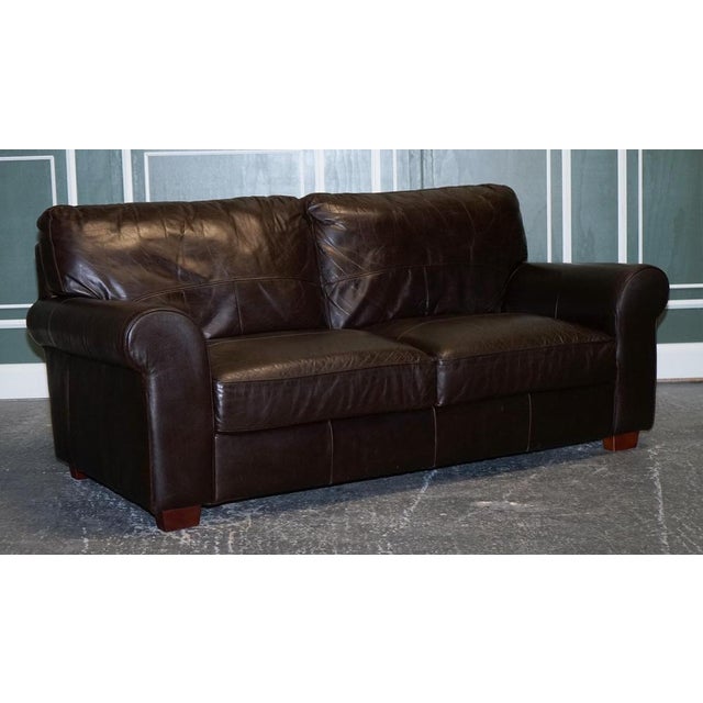 Vintage Chocolate Brown Leather Two To Three Seater Sofa. Very good-looking sofa with all the cushions sewn into the sofa....