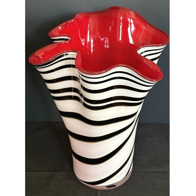 Add timeless elegance to your décor with this beautiful vintage Murano-style hand-blown art glass vase. Featuring the...