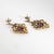 Elegant pair of antique Edwardian earrings (circa 1910s) crafted in 14k yellow gold. Cushion cut amethysts measure 9.10 x...
