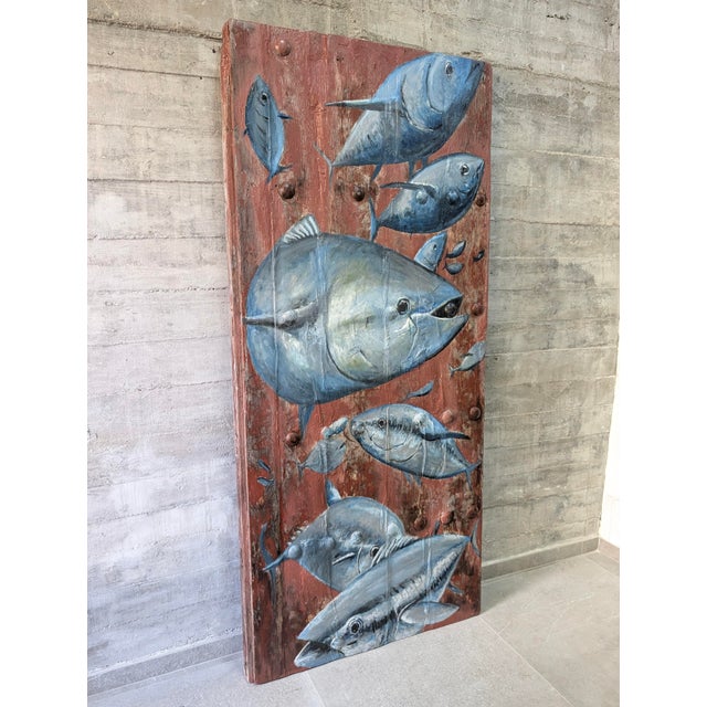 This large 19th-century wooden door comes from a traditional Andalusian farmhouse in Málaga, southern Spain, and has been...