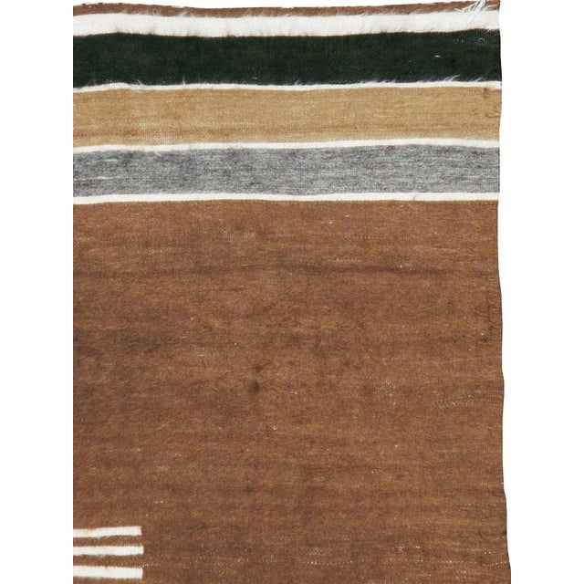 A vintage Turkish folk rug in accent size with a tribal design handmade with long and lustrous mohair in tobacco brown,...