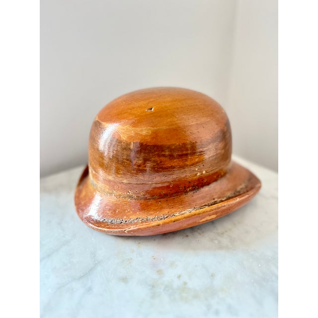 The mold consists of two removable parts — crown and brim — allowing hat makers to form the characteristic rounded...