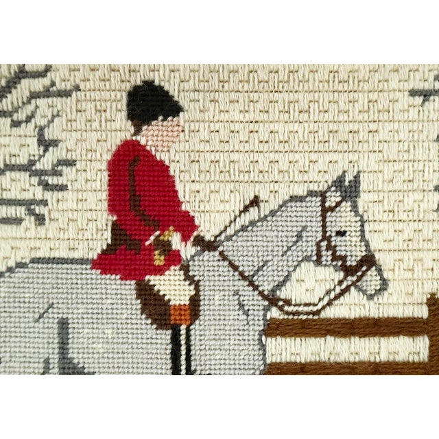 Framed equstrian needle work has been hand stitched with wool yarns using multiple stitches to create different visual...