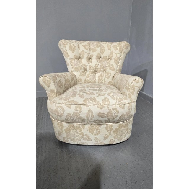 A good cream floral linen covered deep buttoned boudoir chair in excellent overall condition.