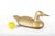 A solid and weighted cast brass duck form sculptural door stop modeled in a traditional resting pose, with a softly...