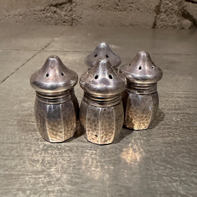 For your consideration, a set of four vintage Vincent Lollo sterling silver individual salt and pepper shakers....