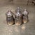 For your consideration, a set of four vintage Vincent Lollo sterling silver individual salt and pepper shakers....
