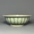 This lobed‑form bowl is made of authentic Longquan Celadon. It features classic celadon‑green glaze with natural...