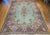 "An elegant vintage oversized Persian Kerman carpet woven circa the 1940s in a rare and breathtaking pale green — a color...
