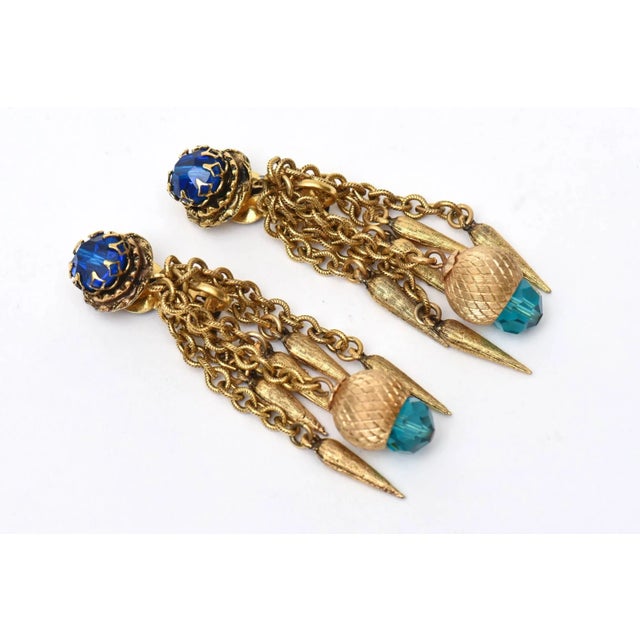 This is part of Chairish’s Costume Jewelry assortment. These beautiful vintage long dangle pair of vintage clip on...