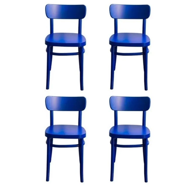 Set of 4 blue mzo chairs by mazo design. Dimensions: w 46 x d 50 x h 75 cm. Materials: beech. This iconic chair played a...