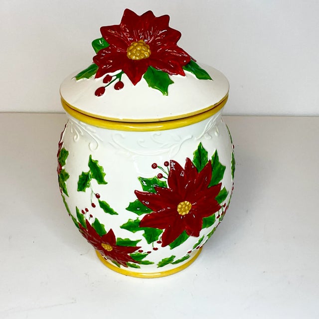 This is a lovely Christmas canister. It features a Majolica finish and large Poinsettia botanicals. The lid has a raised...