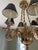 A striking solid brass swan‑arm chandelier featuring six sculpted bird figures, warm polished brass, and elegant black...