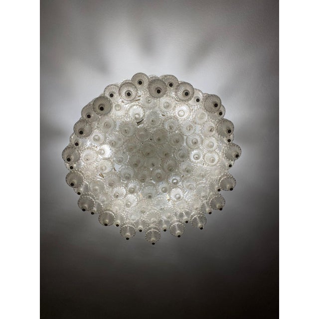 Murano glass chandelier composed of rows of spinning top-shaped pendants, made by the Salviati art glassworks in the 1960s...