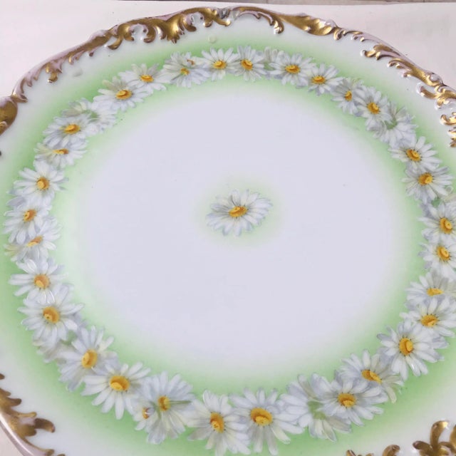 Tresseman & Vogt Limoges, France has been the producer of stunning hand decorated porcelain. The “Daisy Chain” pattern has...