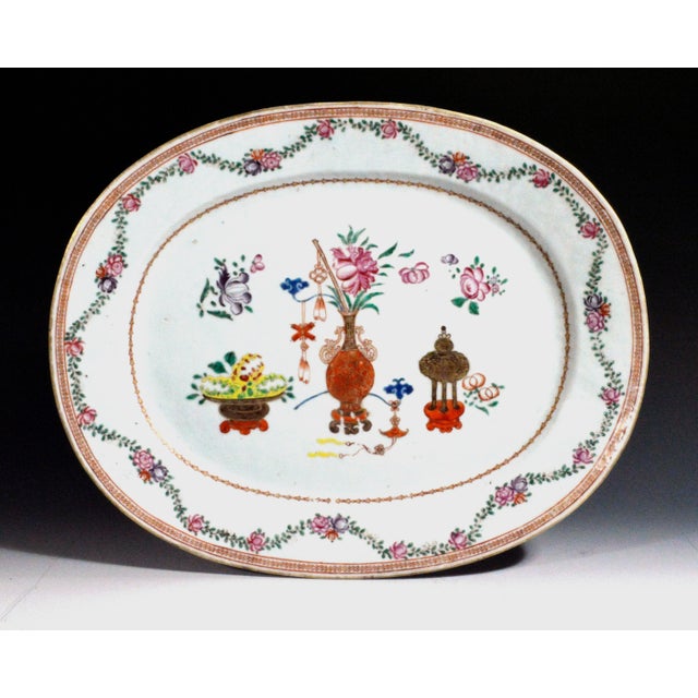 The Chinese ExpoScholarly Abundance: Famille Rose 'Precious Objects' Dish Object: Chinese Export porcelain Oval Serving...
