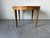Beautiful vintage Mid Century Modern expandable dining table featuring a stunning bookmatched veneer top with a burl wood...