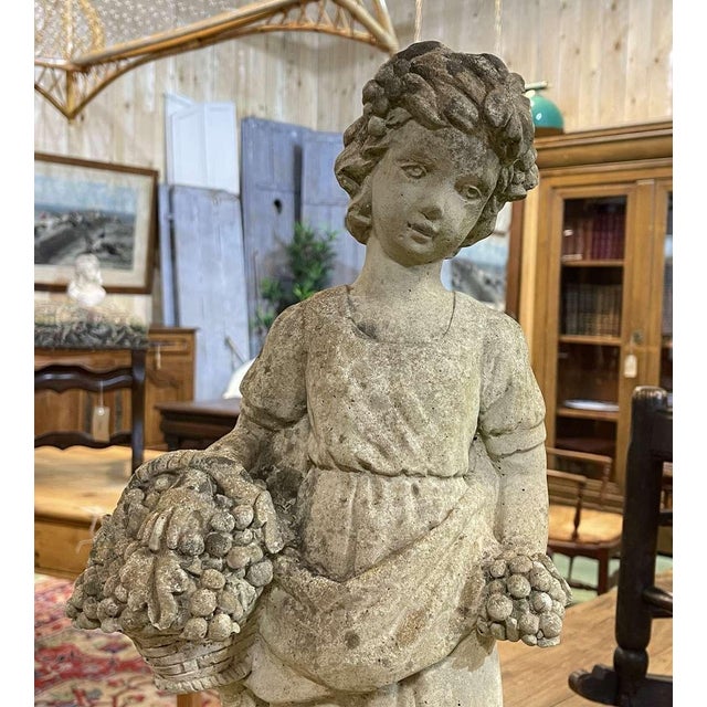 Reconstituted Stone Garden Statue Depicting a Young Woman with a Basket, 1970s, in Good conditions. Designed 1970 to 1979