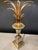Pair of chromed metal table lamps with truncated conical vase-shaped stems, topped with a sheaf of gilt brass palm leaves....