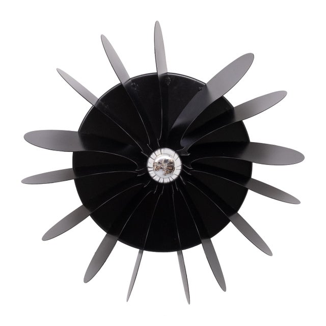 Metal wall or ceiling lamp released by Raak Amsterdam. This expressive piece was designed by Hermian Sneyders de Vogel,...
