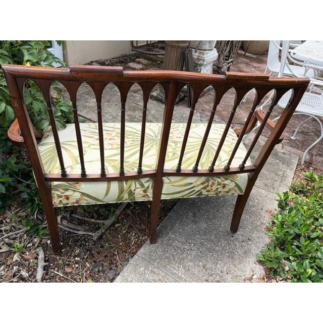 The Antique Walnut American Love Seat is a charming piece of furniture with a rich brown Edwardian style design. Made from...