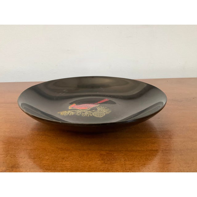 Add a touch of iconic Mid-Century Modern artistry to your home with this vintage black utility dish handcrafted by Couroc...