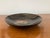 Add a touch of iconic Mid-Century Modern artistry to your home with this vintage black utility dish handcrafted by Couroc...