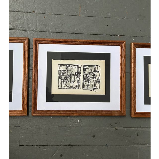 Set of three contemporary original Wayne Cunningham abstract marker drawings on vintage book pages. All signed and framed....