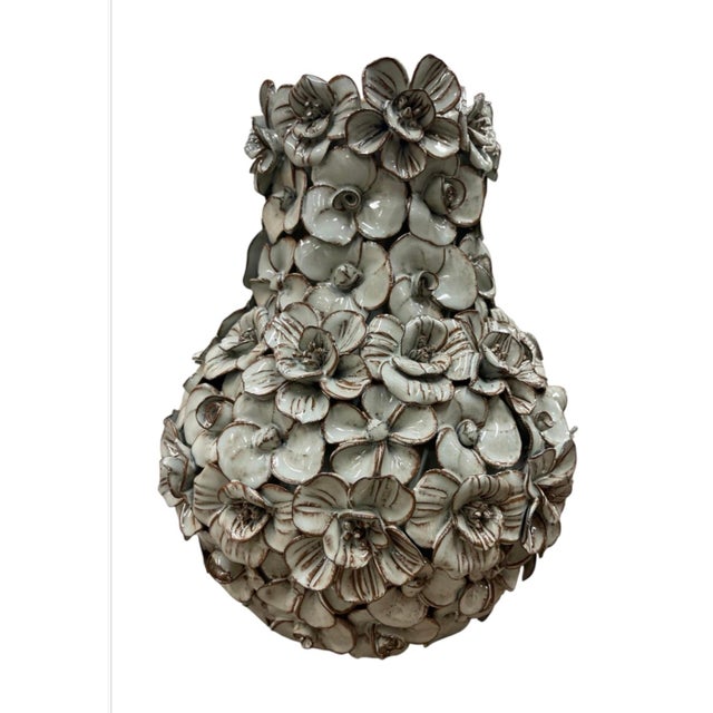 This striking vintage Italian ceramic vase is a masterclass in high-texture dimensional studio pottery. Handcrafted with...