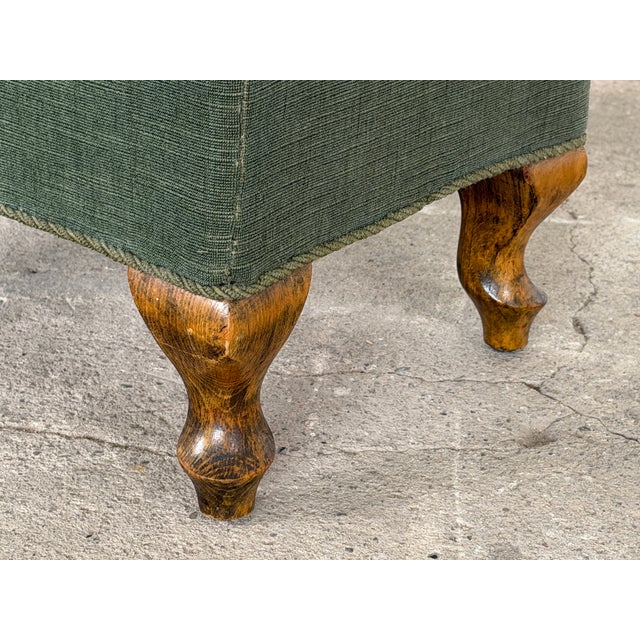A walnut footstool with hand-worked needlepoint top in the Queen Anne style, England or Northern Europe, early 20th...