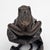 A finely detailed Japanese bronze okimono sculpture depicting a frog perched on a lotus leaf, with a coiled stem-form base...