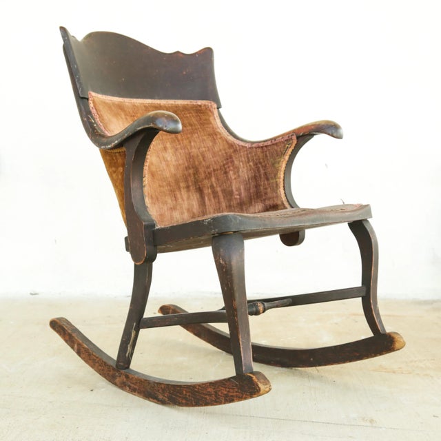 A well loved antique rocking chair in Emire style, appears to be around 100-150y old. Beautiful shapes & proportions!...