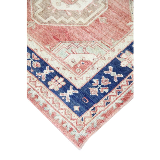 Introducing a one-of-a-kind vintage Turkish hand-knotted wool rug, carefully crafted by skilled artisans using traditional...