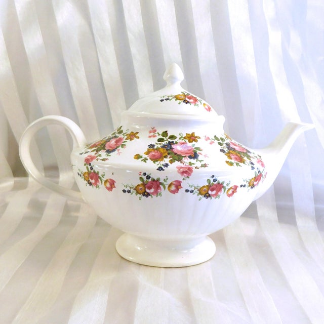 This is an Arthur Wood multicolor floral teapot in Pattern 6333. I do not have a date for this pattern. The teapot is...