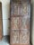 Infuse your home with timeless character through this vintage hand-carved barn door, masterfully crafted from reclaimed...