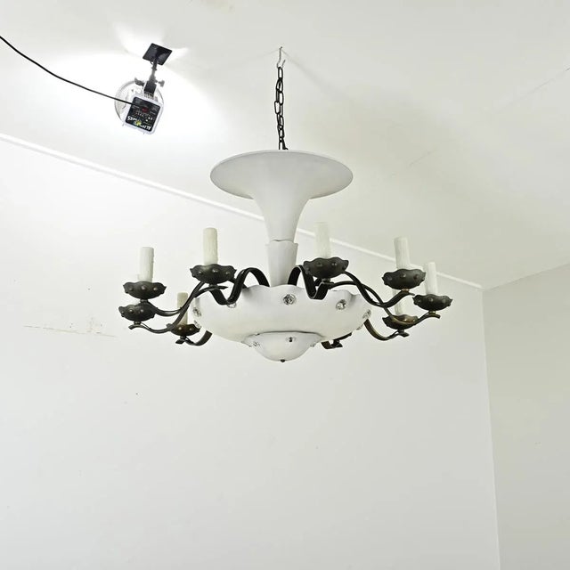 Here is a very unique French chandelier from the mid-20th century, taking elements from Art Deco combined with Hollywood...