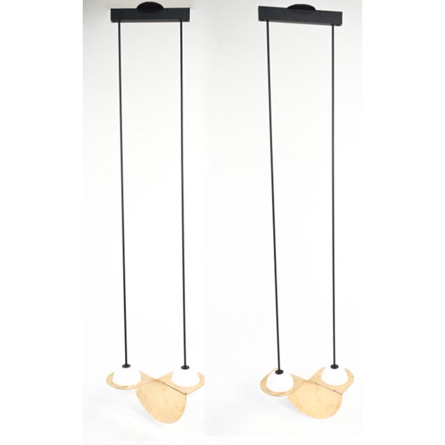 Illuminate your space with a striking pair of pendants by Lambert & Fils. The Laurent 01 pendant features a sophisticated...