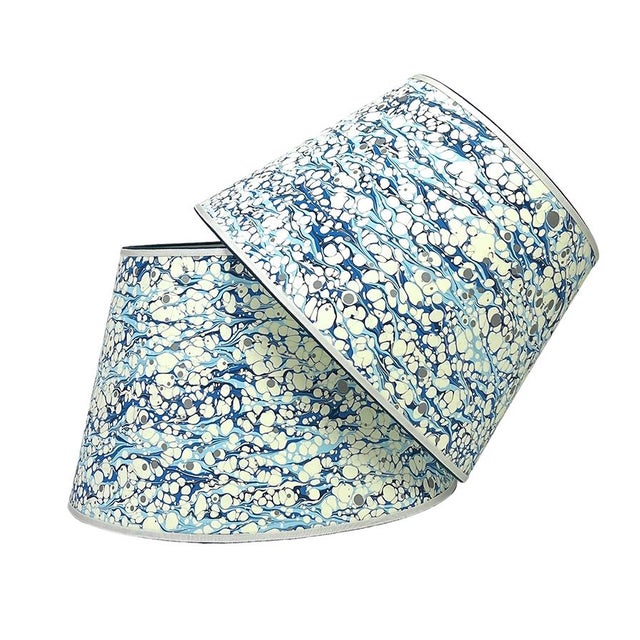 Fabulous marbled lace pattern paper in a striking array of blues and white; trimmed in two colors of grosgrain. Available...